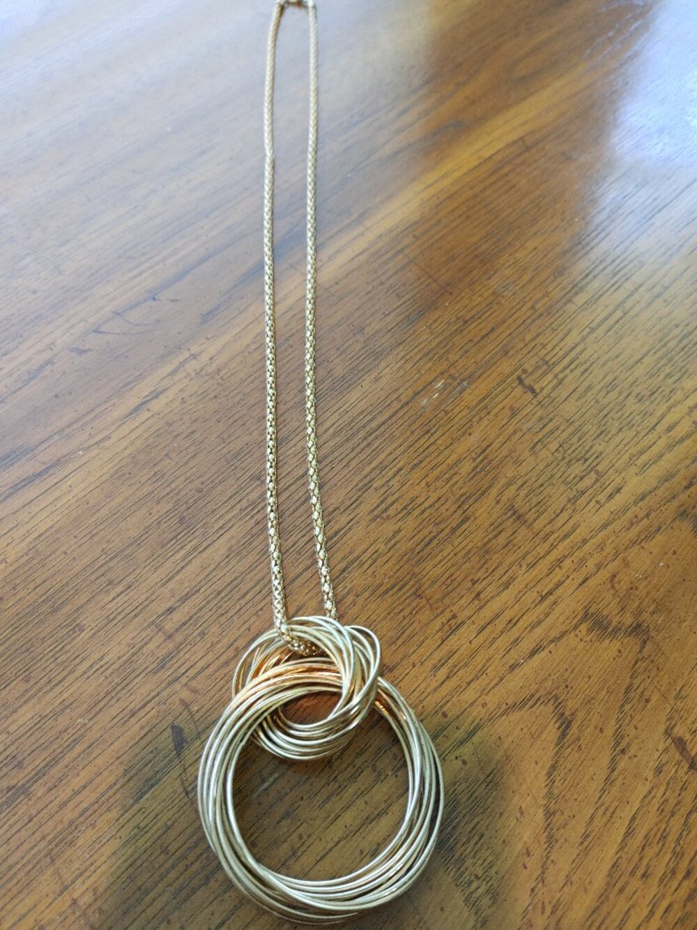 Gold tone double ring necklace